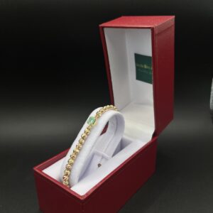 manilla de oro rosado y amarillo de 18k con esmeralda
